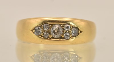 Lot 1353 - An 18ct yellow gold ring set with six small...