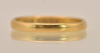 Lot 1340 - A 22ct yellow gold band ring, size Q/R, approx...