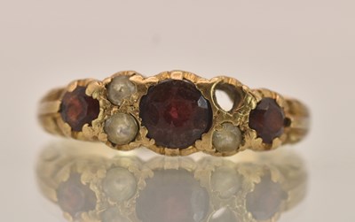 Lot 1389 - A 9ct rose gold ring set with three graduated...