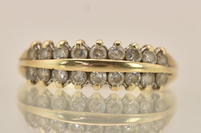 Lot 1405 - A yellow gold double row diamond set ring,...