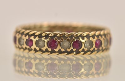 Lot 1394 - A 9ct yellow gold red and white stone set...