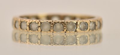 Lot 1418 - A 9ct yellow gold white stone set eternity...