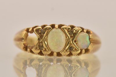 Lot 1279 - An 18ct yellow gold ring set with three...