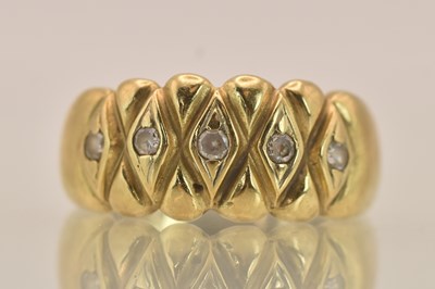 Lot 1390 - A 9ct yellow gold ring set with five white...