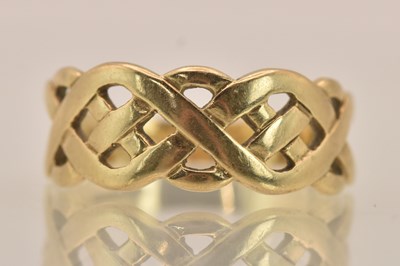 Lot 1391 - A 9ct rose gold Celtic design ring, size T,...