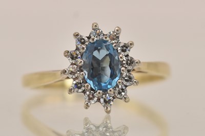 Lot 1367 - A yellow gold ring with central aquamarine...