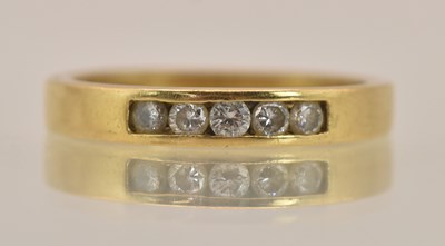 Lot 1349 - An 18ct yellow gold half eternity ring with...