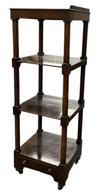 Lot 77 - A Victorian rosewood four tiered whatnot with...