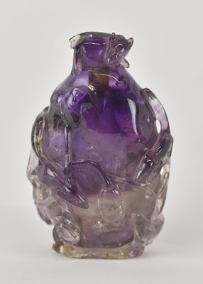 Lot 1082 - A 19th century Chinese carved amethyst netsuke...