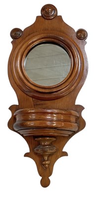 Lot 88 - A late 19th century oak mirrored wall hanging...