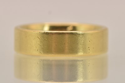 Lot 1326 - A heavy 18ct yellow gold band ring, size R,...