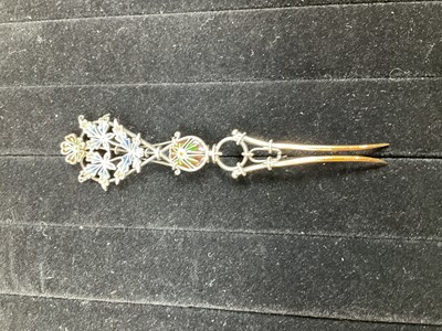 Lot 525 - A white metal plique-à-jour enamel hair slide...