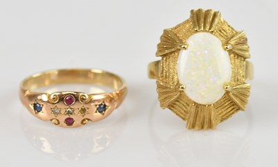 Lot 612 - A yellow metal opal dress ring, stamped '585',...
