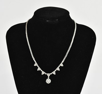 Lot 282 - A diamond set necklace with circular diamond...