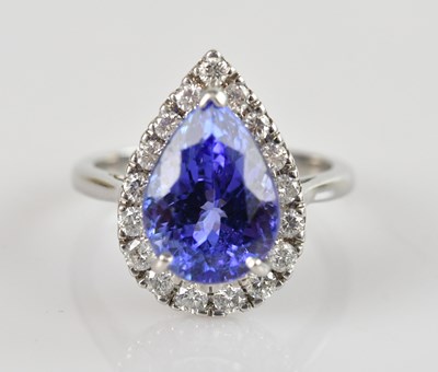 Lot 457 - An 18ct white gold diamond and tanzanite, the...