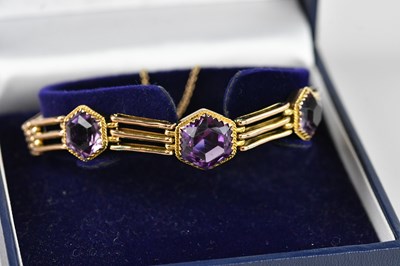 Lot 66 - A 9ct yellow gold gate link bracelet set with...