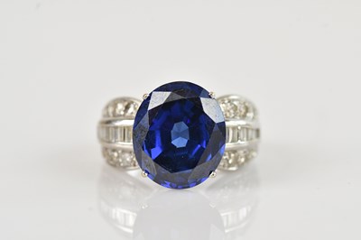 Lot 458 - A white metal diamond and tanzanite cluster...