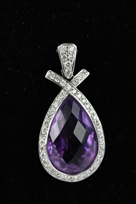 Lot 292 - A white metal diamond and amethyst set pendant,...