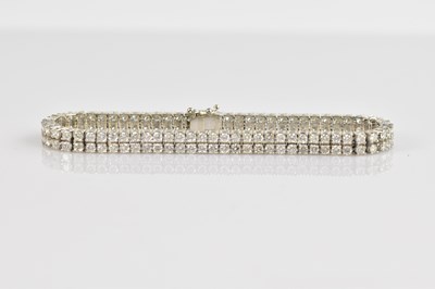 Lot 60 - A good white metal diamond set double strand...