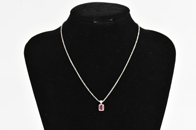 Lot 318 - A pink sapphire and diamond set pendant, the...