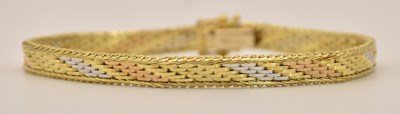 Lot 1513 - An 18ct three colour gold woven bracelet,...