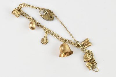 Lot 111 - A hallmarked silver charm bracelet with...