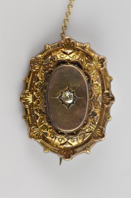 Lot 160 - A Victorian yellow metal oval target brooch,...
