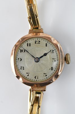 Lot 1087 - A lady's 9ct gold cased wristwatch, the engine...