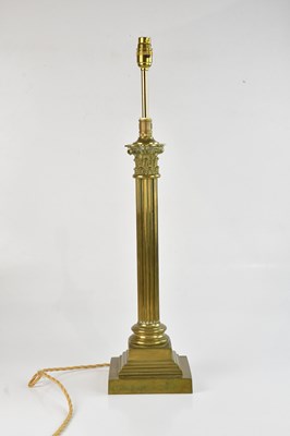 Lot 1335 - An Edwardian brass Corinthian column table...