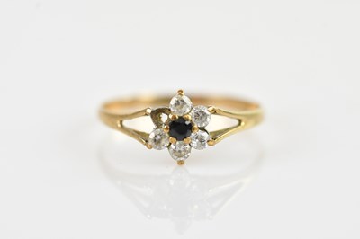Lot 681 - A 9ct gold dress ring set with five clear...