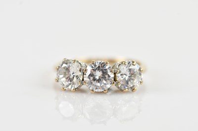 Lot 653 - A 9ct yellow and white gold three stone dress...