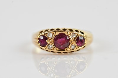 Lot 506 - An 18ct yellow gold diamond and ruby five...