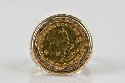 Lot 505 - A 1983 1/10 oz fine gold Krugerrand ring,...