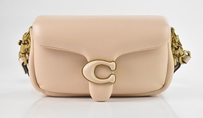 Lot 1455 - COACH; a soft padded beige nappa leather...