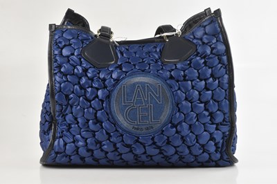Lot 1436 - LANCEL; an unused blue recycled nylon and soft...