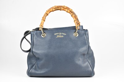 Lot 1401 - GUCCI; a navy blue pebbled leather Bamboo...