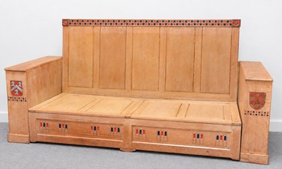 Lot 15 - YORKSHIRE SCHOOL; a carved light oak settle...