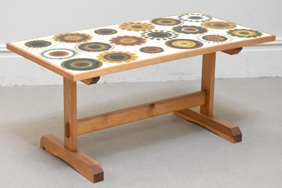 Lot 47 - A contemporary pine coffee table, set with...