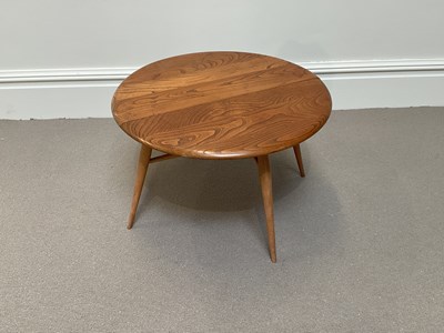 Lot 2117 - ERCOL; an elm and beach drop-leaf coffee table...