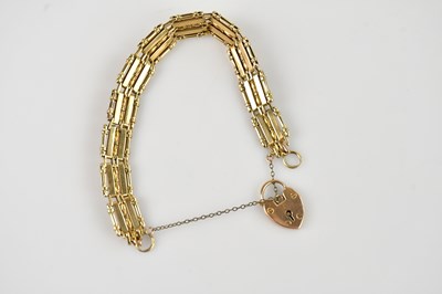 Lot 112 - A yellow metal gate link bracelet with 9ct...