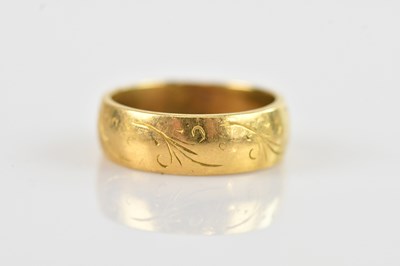 Lot 643 - An 18ct yellow gold wedding band, size L,...