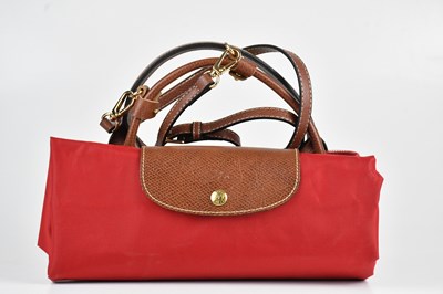 Lot 1562 - LONGCHAMP; a red nylon extra large Le Pliage...