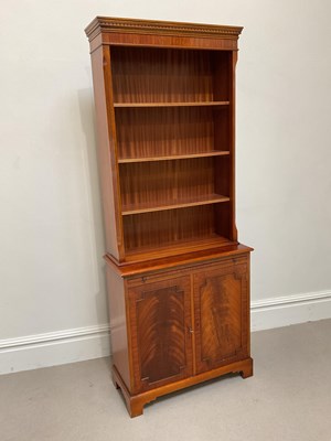 Lot 1066 - A reproduction mahogany bookcase, with three...