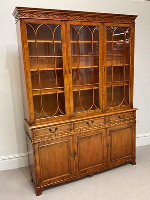 Lot 1060 - A reproduction mahogany library bookcase, with...