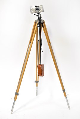 Lot 809 - An Olympus Superzoom 100G camera on a wooden...