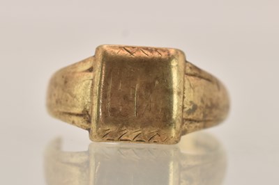 Lot 1404 - A 9ct gold signet ring with blank table, cut...