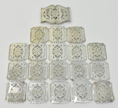 Lot 1181 - A hallmarked silver belt buckle and panels,...