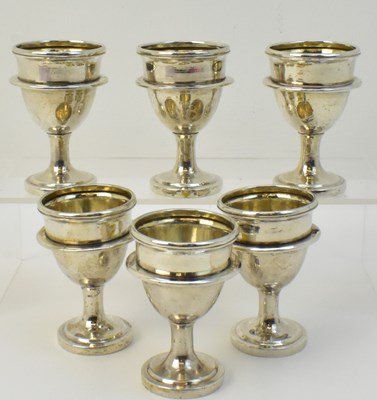 Lot 1051 - A set of six Chinese silver egg cups, Chinese...