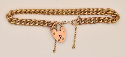 Lot 1523 - A 9ct rose gold bracelet with 9ct gold heart...