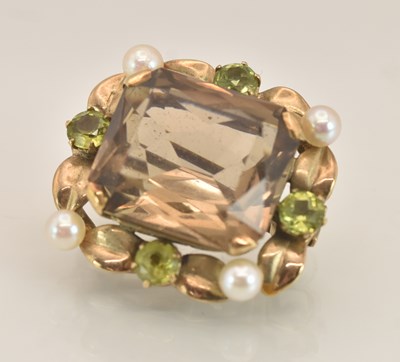 Lot 1475 - A 9ct gold brooch, with claw set cushion cut...